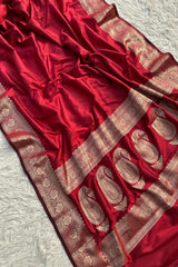Divya Darshini ft. in Banarasi Soft Semi Katan Silk Saree Red with Silver embroidery on a textured white background