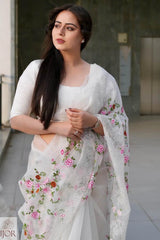 Nav Kaur wearing a Banarasi Soft Organza Silk Saree Ivory with floral embroidery in an outdoor setting