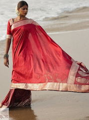 Divya Darshini ft. in Banarasi Soft Semi Katan Silk Saree Red walking on a beach