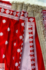 Red Mashru Silk Saree with Maharani Laces and gold accents, featuring the brand 'JOR'.