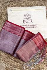 Lavender Color Pure Tissue Cotton Saree with Rich Red Border with a white bag featuring 'IJOR' branding on a textured surface.