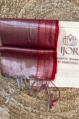 Lavender Color Pure Tissue Cotton Saree with Rich Red Border with a brand label on a beige carpet