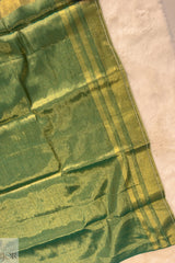Green Golden Zari Pure Tissue Cotton Saree on a beige background