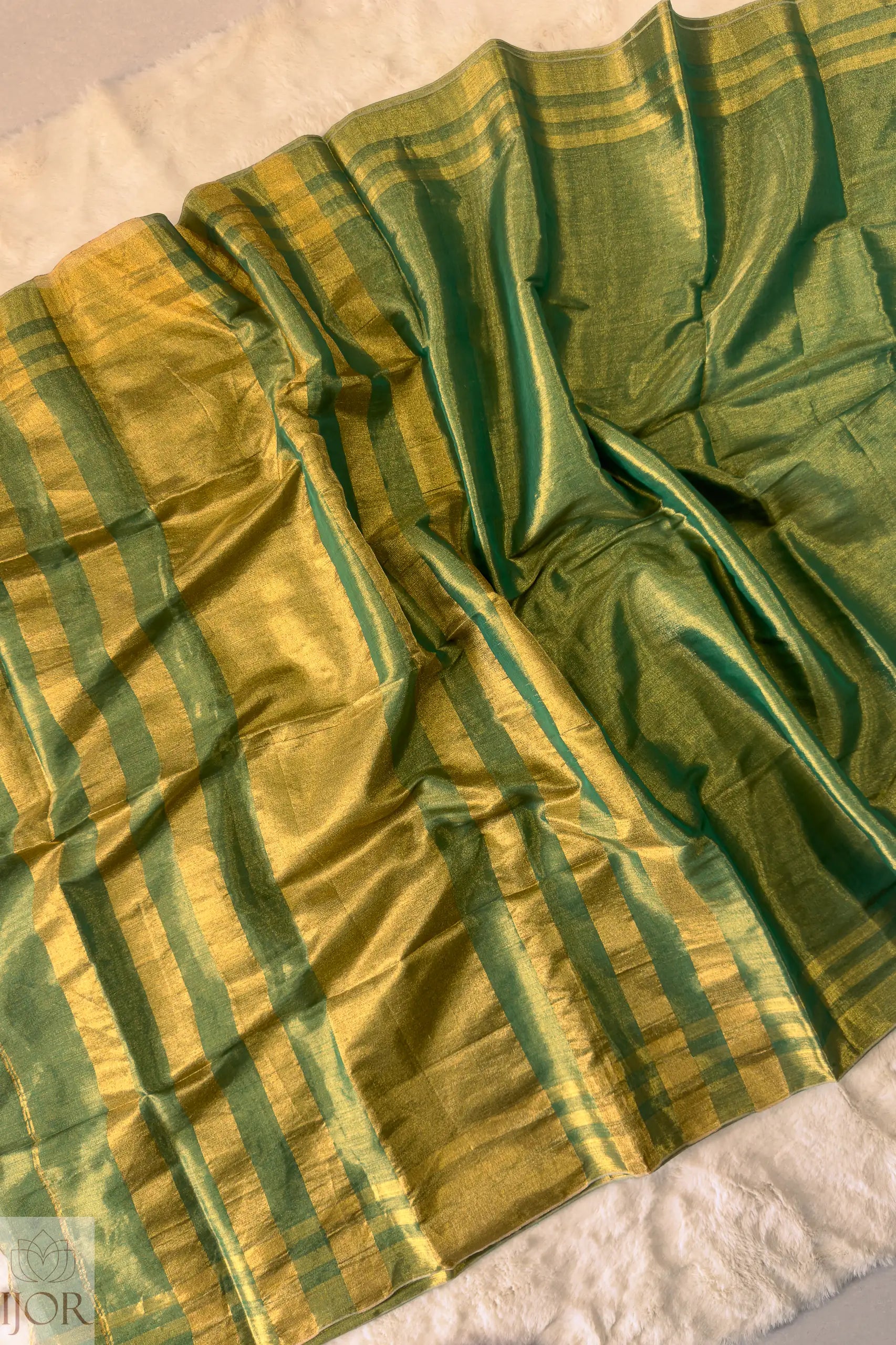 Green Golden Zari Pure Tissue Cotton Saree showing anchal, border and body of the saree on a white background