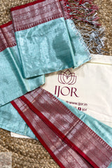 Turquoise Blue Pure Tissue Cotton Saree with Rich Red Border and 'IJOR' branding on a textured surface.