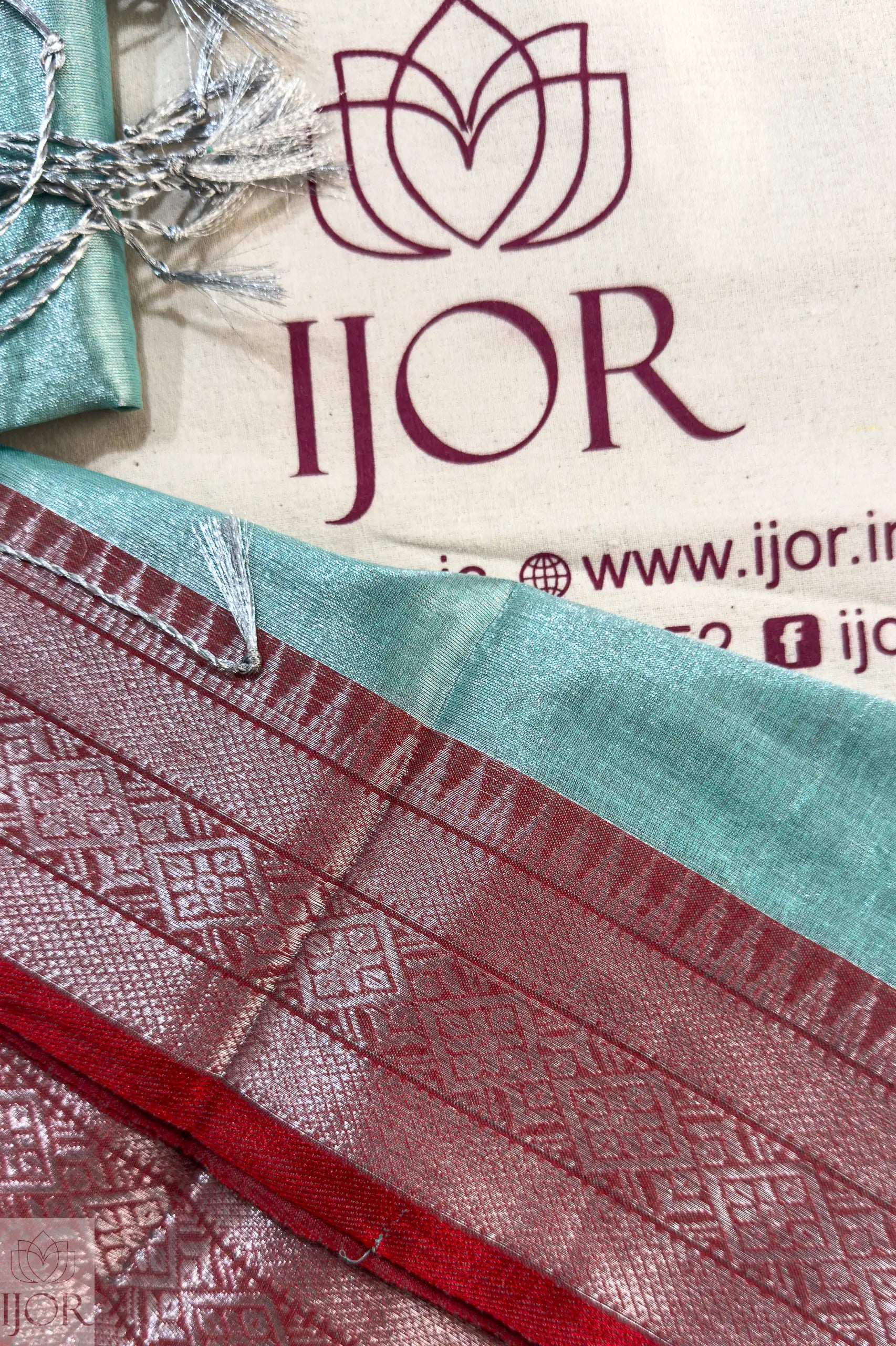 Turquoise Blue Pure Tissue Cotton Saree with Rich Red Border with IJOR branding and product details