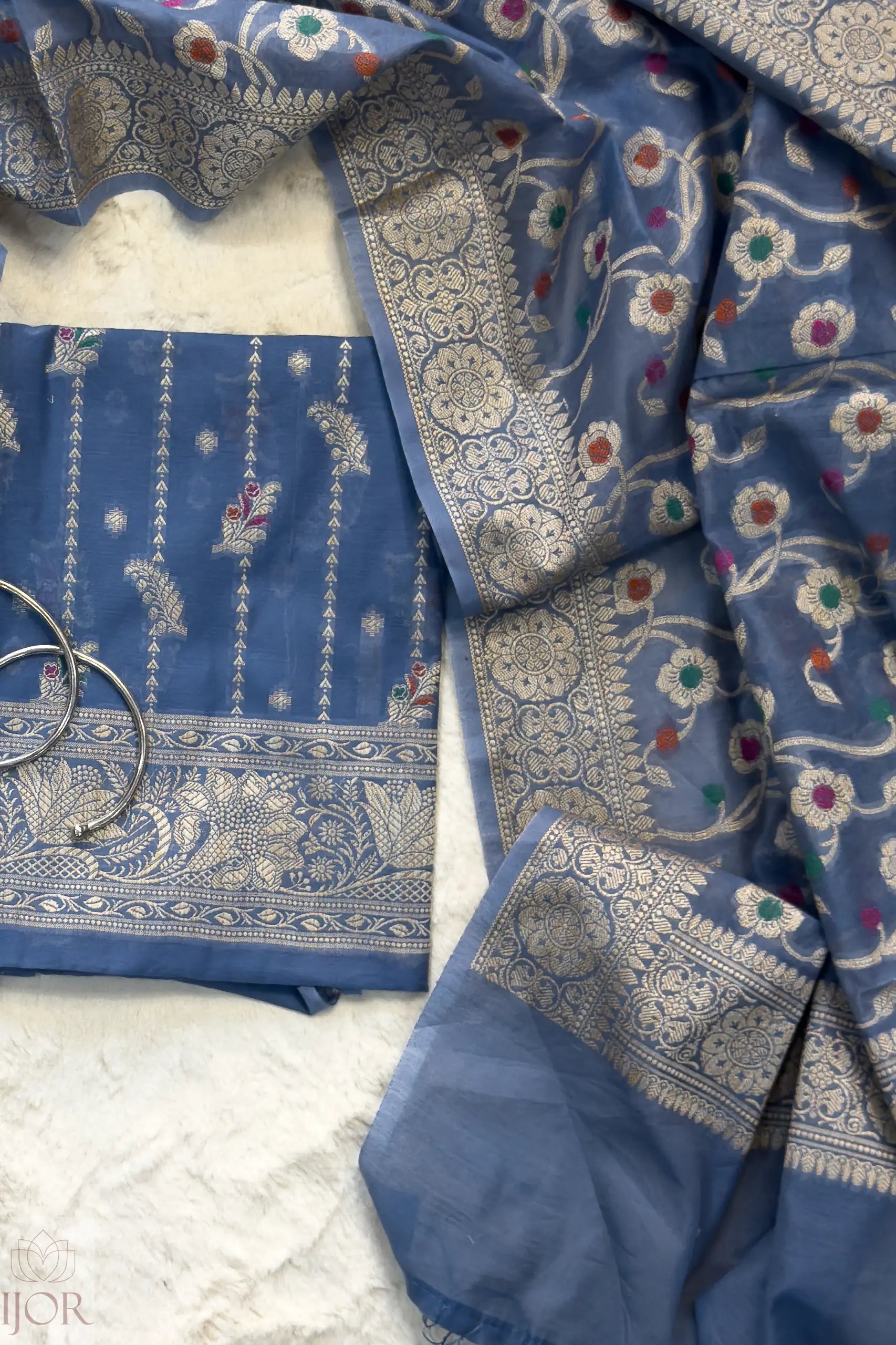 Dusty Blue Muga Silk in Minakari work Unstitched Suit with intricate patterns on a white background