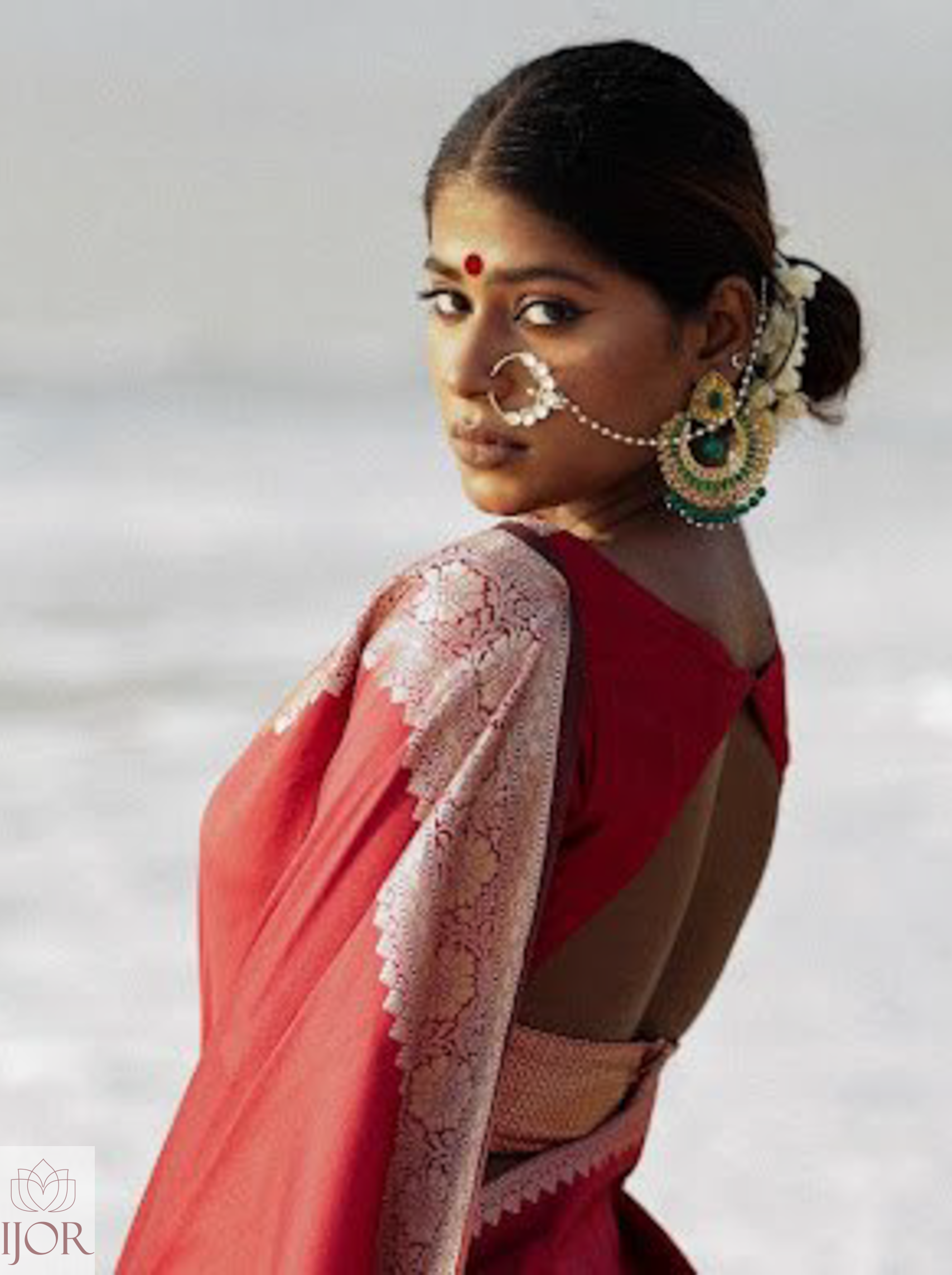Divya Darshini ft. in Banarasi Soft Semi Katan Silk Saree Red with a blurred background