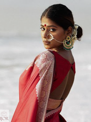Divya Darshini ft. in Banarasi Soft Semi Katan Silk Saree Red with a blurred background