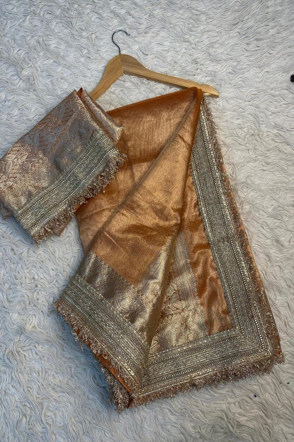 Golden Soft Tissue Silk Maharani Saree with premium lace.