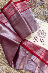 Folded Lavender Color Pure Tissue Cotton saree with red border and 'IJOR' brand logo on a textured surface