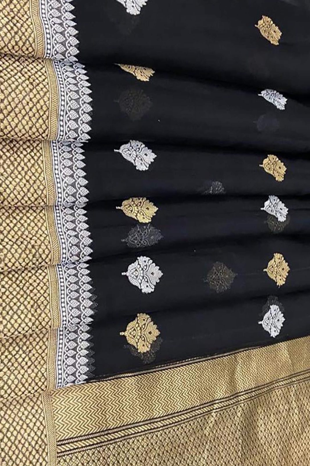 Kora Orgenza Silk Black saree with gold and white floral patterns